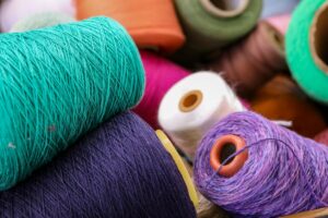 several spools of thread and spools of thread on a table